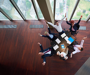 Image showing top view of business people group throwing dociments in air