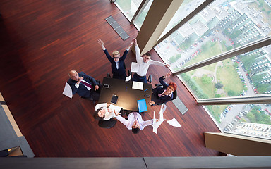 Image showing top view of business people group throwing dociments in air