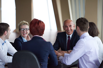 Image showing business people group on meeting at modern bright office