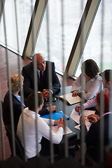 Image showing business people group on meeting at modern bright office