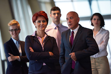 Image showing diverse business people group with redhair  woman in front