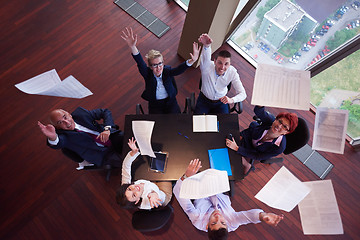 Image showing top view of business people group throwing dociments in air