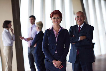 Image showing diverse business people group with redhair  woman in front