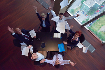 Image showing top view of business people group throwing dociments in air