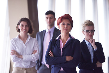 Image showing diverse business people group with redhair  woman in front