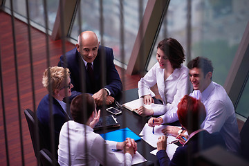 Image showing business people group on meeting at modern bright office