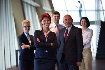 Image showing diverse business people group with redhair  woman in front