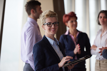 Image showing diverse business people group with blonde  woman in front