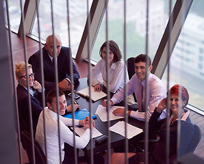 Image showing business people group on meeting at modern bright office