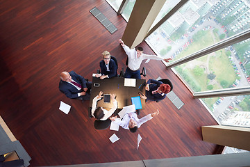 Image showing top view of business people group throwing dociments in air