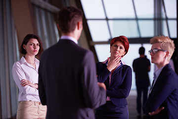 Image showing business people group on meeting at modern bright office