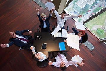 Image showing top view of business people group throwing dociments in air