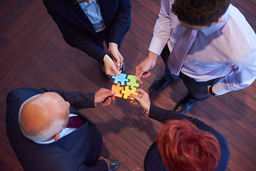 Image showing assembling jigsaw puzzle