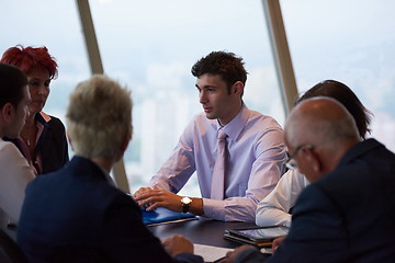 Image showing business people group on meeting at modern bright office