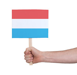 Image showing Hand holding small card - Flag of Luxembourg