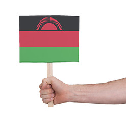 Image showing Hand holding small card - Flag of Malawi