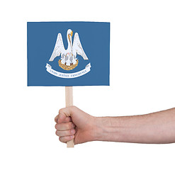 Image showing Hand holding small card - Flag of Louisiana