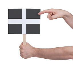 Image showing Hand holding small card - Flag of Cornwall