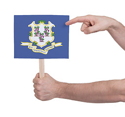 Image showing Hand holding small card - Flag of Connecticut
