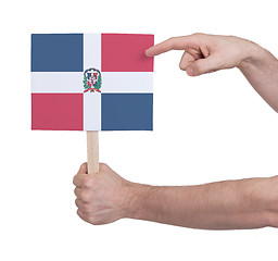 Image showing Hand holding small card - Flag of Dominican Republic