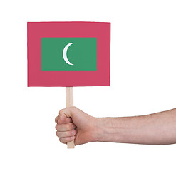 Image showing Hand holding small card - Flag of Maldives