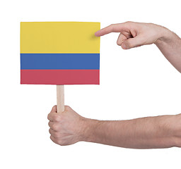 Image showing Hand holding small card - Flag of Colombia