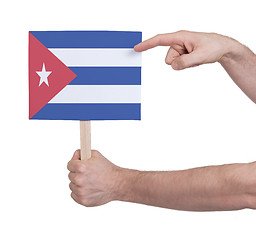 Image showing Hand holding small card - Flag of Cuba