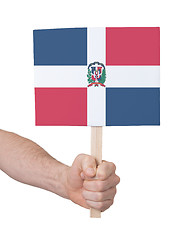 Image showing Hand holding small card - Flag of Dominican Republic