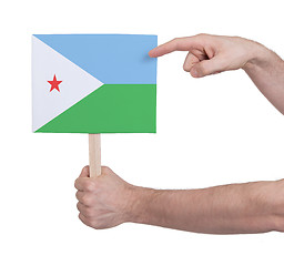 Image showing Hand holding small card - Flag of Djibouti