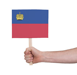 Image showing Hand holding small card - Flag of Liechtenstein