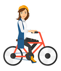 Image showing Woman riding bicycle.