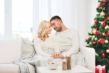 Image showing happy couple at home with christmas tree