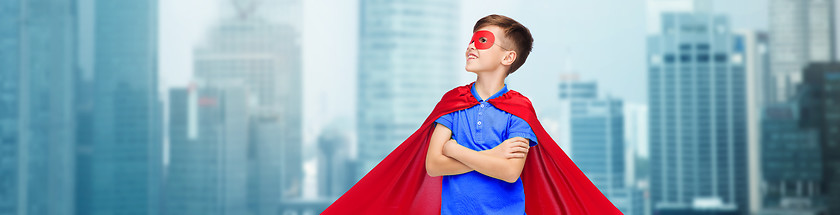 Image showing boy in red super hero cape and mask