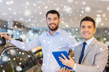 Image showing happy man with car dealer in auto show or salon