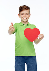 Image showing happy boy showing red heart shape and thumbs up