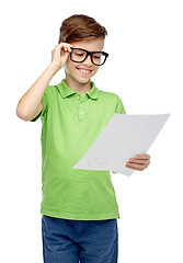 Image showing happy boy in eyeglasses holding school test result