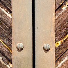 Image showing stripped paint  door    in italy   ancian wood and traditional  