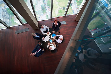 Image showing top view of business people group throwing dociments in air