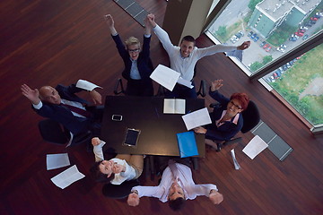 Image showing top view of business people group throwing dociments in air