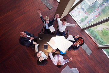 Image showing top view of business people group throwing dociments in air