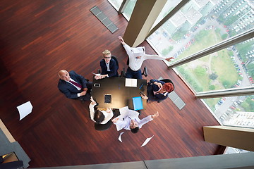 Image showing top view of business people group throwing dociments in air