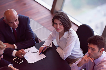 Image showing business people group on meeting at modern bright office