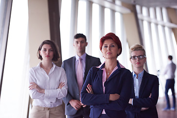 Image showing diverse business people group with redhair  woman in front