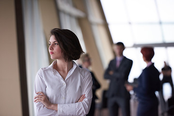 Image showing business people group, woman in front  as team leader