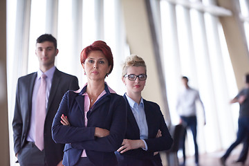 Image showing diverse business people group with redhair  woman in front