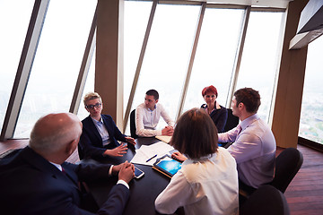 Image showing business people group on meeting at modern bright office