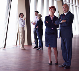 Image showing diverse business people group with redhair  woman in front