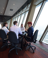 Image showing business people group on meeting at modern bright office