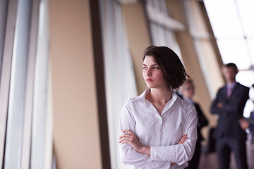 Image showing business people group, woman in front  as team leader