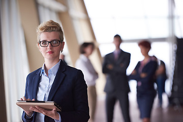 Image showing business woman  at office with tablet  in front  as team leader